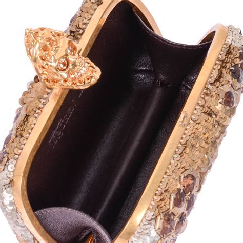 gold alexander mcqueen clutches